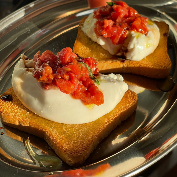 Crostini with Burrella, Tomato Tartare, Fresh Basil, Oregano, Balsamic Glaze and EVOO.