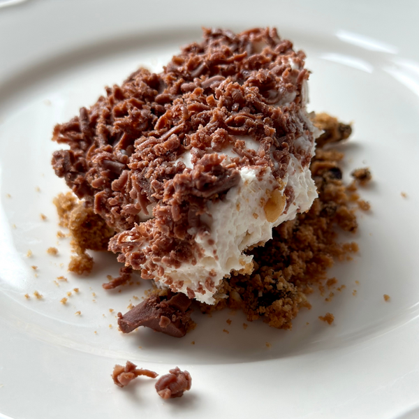 RHYTHM 108 COOKIE CRUMBLE CHEESECAKE WITH  HAZELNUT CHOCOLATE SHAVINGS FT CREMATTA®